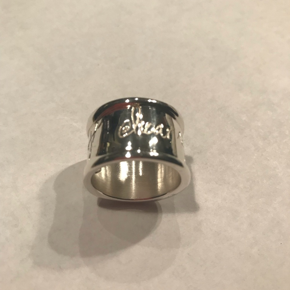 Never worn sterling sliver inscribed ring